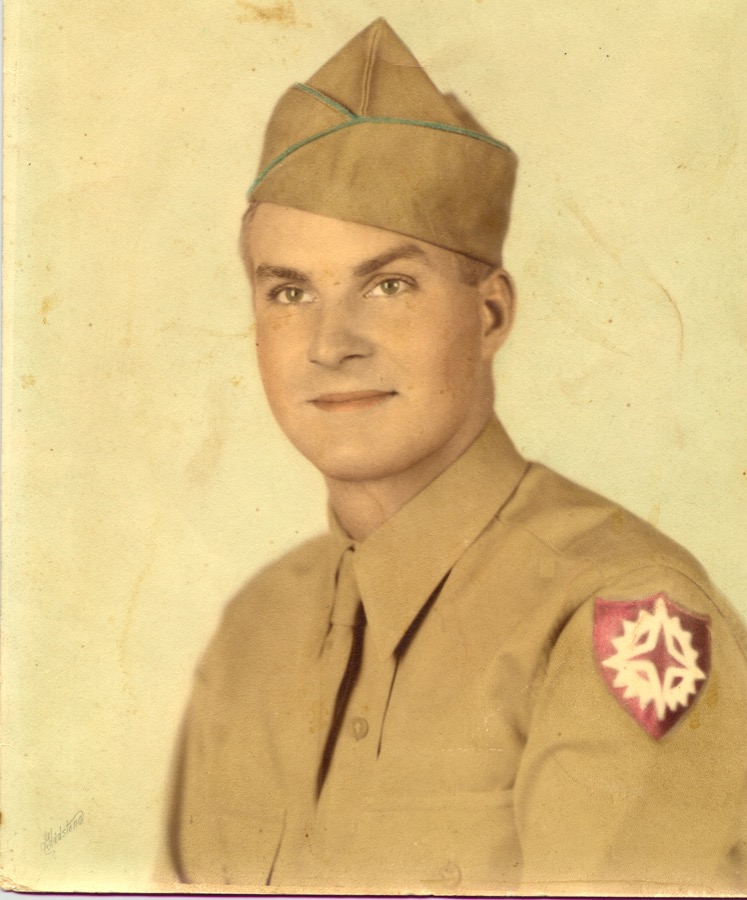 Formal wartime portrait of PFC Sidney Fendel King in uniform.